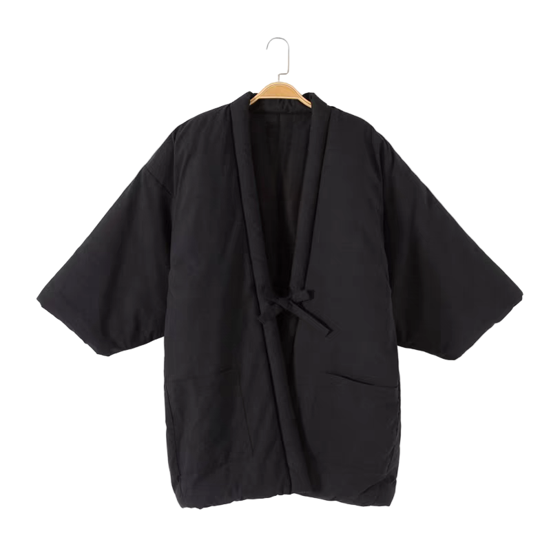 Black kimono-style garment on a hanger against a white background