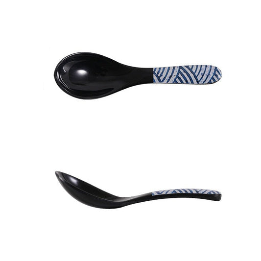A pair of black melamine spoon with blue and white wave pattern accents.