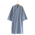 Blue and white striped robe on a hanger against a white background