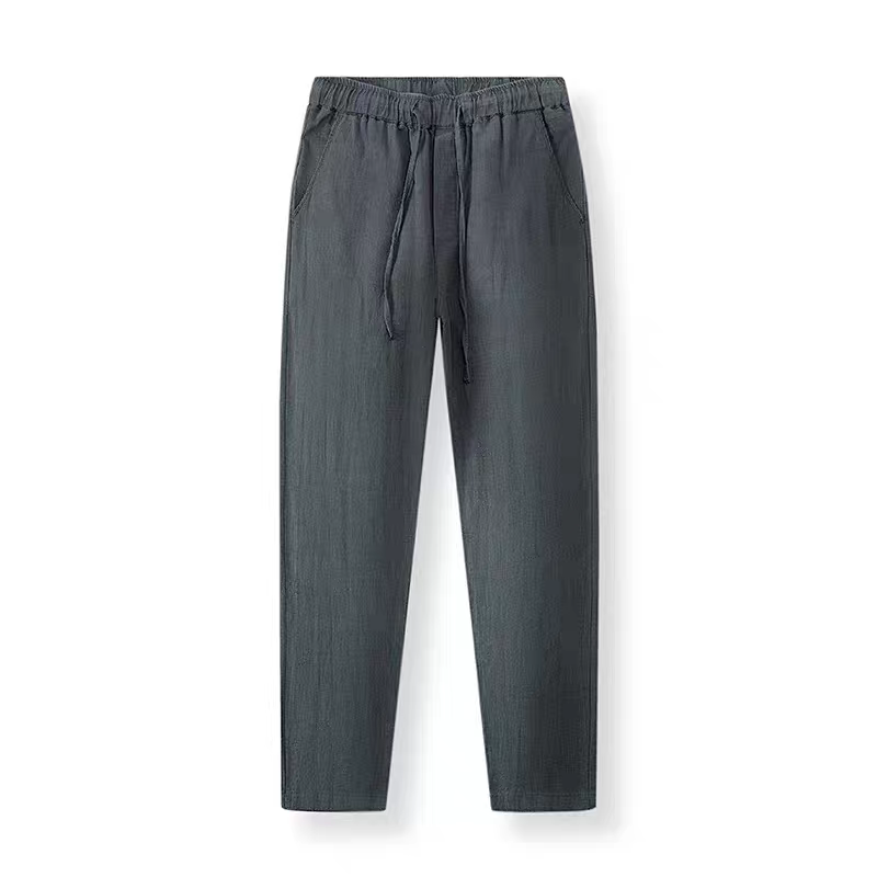 A pair of dark gray drawstring pants with an elastic waistband, displayed flat against a plain white background.