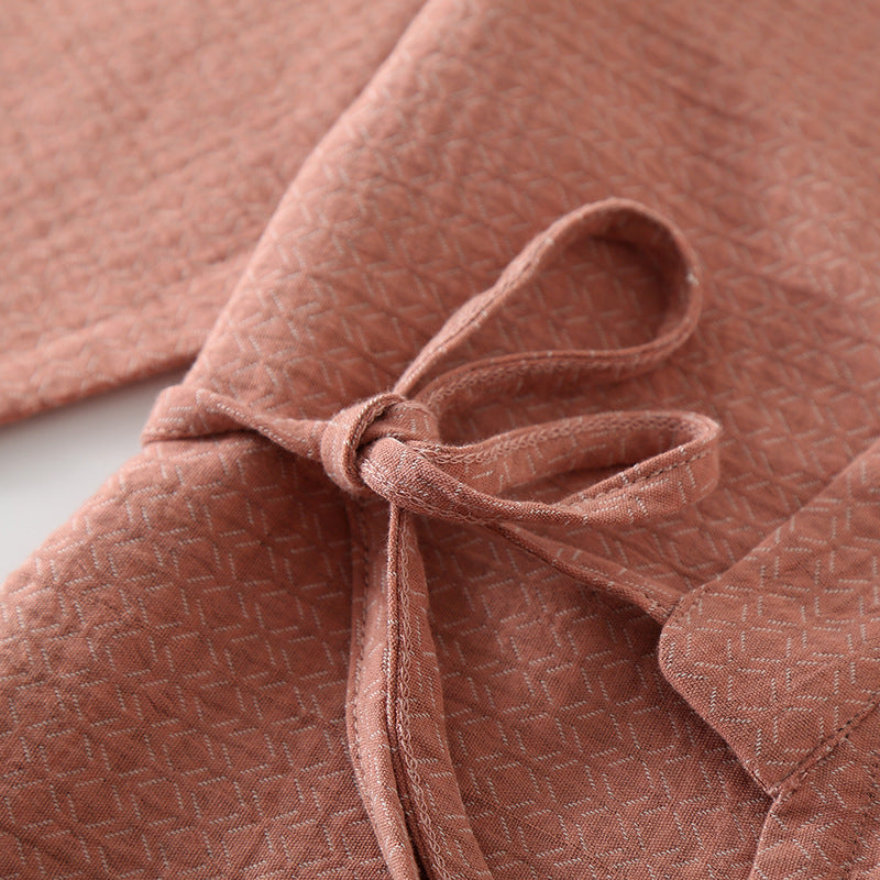 Close-up of a pink textured fabric with a bow