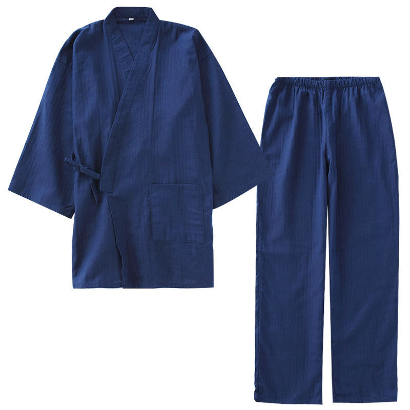 Blue martial arts uniform with a robe and pants on a white background