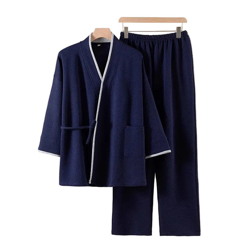 Navy blue robe and pants set on a beige background